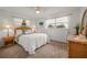 Bedroom with a full bed, wicker furniture, and window at 542 Sutton Pl, Longboat Key, FL 34228