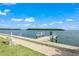 Private boat dock with access to the bay, perfect for enjoying water activities at 542 Sutton Pl, Longboat Key, FL 34228