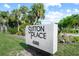 Sutton Place community entrance sign at 542 Sutton Pl, Longboat Key, FL 34228