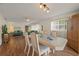 Dining area with hardwood floors and a view to the living room at 542 Sutton Pl, Longboat Key, FL 34228