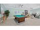 Relaxing game room with pool table and comfortable seating at 542 Sutton Pl, Longboat Key, FL 34228