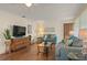 Bright living room featuring hardwood floors and ample seating at 542 Sutton Pl, Longboat Key, FL 34228