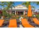 Bahama Bar with lounge chairs and orange umbrellas at 12720 Sorrento Way # 102, Bradenton, FL 34211