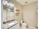 Bathroom boasts granite countertop, new vanity, and shower at 12720 Sorrento Way # 102, Bradenton, FL 34211