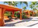 Relaxing cabanas with orange cushions near the pool at 12720 Sorrento Way # 102, Bradenton, FL 34211