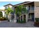 Exterior of condo with stairs and landscaping at 12720 Sorrento Way # 102, Bradenton, FL 34211