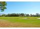 Expansive golf course with lush greens and sand traps at 12720 Sorrento Way # 102, Bradenton, FL 34211