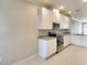 Modern kitchen with white cabinets and granite countertops at 12720 Sorrento Way # 102, Bradenton, FL 34211