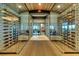 Elegant wine cellar with glass walls and extensive wine storage at 12720 Sorrento Way # 102, Bradenton, FL 34211