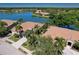 Community overview showcasing lakefront homes and lush landscaping at 8047 Victoria Falls Cir, Sarasota, FL 34243