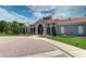 Attractive community clubhouse with brick pavers and landscaping at 8047 Victoria Falls Cir, Sarasota, FL 34243