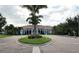 Community clubhouse entrance with a circular driveway at 8047 Victoria Falls Cir, Sarasota, FL 34243