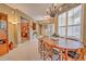 Bright dining area with a round table and mid-century modern chairs at 8047 Victoria Falls Cir, Sarasota, FL 34243