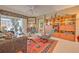 Living room with seating area and a view into the bedroom at 8047 Victoria Falls Cir, Sarasota, FL 34243