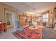 Open living area with seating, a mid-century modern aesthetic and tiled floors at 8047 Victoria Falls Cir, Sarasota, FL 34243