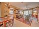 Open concept living and dining area with a mid-century modern aesthetic at 8047 Victoria Falls Cir, Sarasota, FL 34243