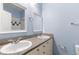 Bathroom with double vanity, granite countertop and mirrors at 7632 Plantation Cir, Bradenton, FL 34201