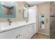 Modern bathroom with double vanity, quartz countertops, and walk-in shower at 4629 Whirlaway Dr # B, Sarasota, FL 34233