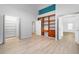 Bright bedroom with built-in shelves and wood-look floors at 4629 Whirlaway Dr # B, Sarasota, FL 34233