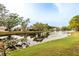 Houses with water views along a canal with lush landscaping at 4629 Whirlaway Dr # B, Sarasota, FL 34233