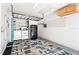 Garage with washer, dryer, shelving, and overhead storage at 4629 Whirlaway Dr # B, Sarasota, FL 34233