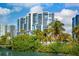 Modern high-rise building with water and city views at 1155 N Gulfstream Ave # 406, Sarasota, FL 34236