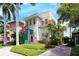 Charming building with lush landscaping and walkway at 1155 N Gulfstream Ave # 406, Sarasota, FL 34236