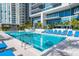 Resort-style pool with ample lounge chairs and a shaded seating area at 1155 N Gulfstream Ave # 406, Sarasota, FL 34236