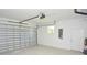 Attached garage with automatic door opener and interior access at 8233 Givlic Ln, North Port, FL 34287