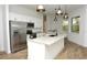 Modern kitchen features stainless steel appliances and a large island at 8233 Givlic Ln, North Port, FL 34287