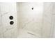 Large walk-in shower with marble-style tile surround at 8233 Givlic Ln, North Port, FL 34287