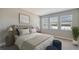 Bright bedroom with neutral decor, featuring a comfortable bed and ample natural light at 5770 Long Shore Loop, Sarasota, FL 34238