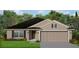 Single-story home with a two-car garage and a well-maintained lawn at 2600 Averland Loop, North Port, FL 34287