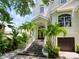 Front entry with stairs leading to the double door entrance at 4929 Oxford Dr, Sarasota, FL 34242