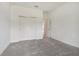 Bedroom with double door closet and grey carpet at 19642 Fort King Run, Brooksville, FL 34601