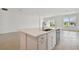 Modern kitchen with white cabinets and a large kitchen island at 19642 Fort King Run, Brooksville, FL 34601