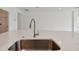 Modern kitchen sink with a stainless steel sink and a pull-down faucet at 19642 Fort King Run, Brooksville, FL 34601