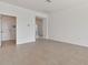 Spacious living room with tile floors and access to other rooms at 19642 Fort King Run, Brooksville, FL 34601