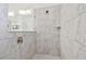 Walk-in shower with marble-look tile at 19642 Fort King Run, Brooksville, FL 34601