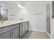 Modern bathroom with double vanity and gray cabinets at 5307 Cappleman Loop, Brooksville, FL 34601