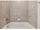 Bathroom with a shower/tub combo and tile surround at 5307 Cappleman Loop, Brooksville, FL 34601