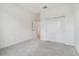 Well-lit bedroom featuring grey carpet and closet at 5307 Cappleman Loop, Brooksville, FL 34601