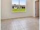 Bright dining room features tile flooring and a view of the backyard at 5307 Cappleman Loop, Brooksville, FL 34601