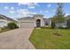 Attractive single-story house with a two-car garage and landscaped lawn at 5307 Cappleman Loop, Brooksville, FL 34601