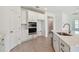 Island kitchen with stainless steel sink and white cabinets at 5307 Cappleman Loop, Brooksville, FL 34601