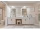 Elegant bathroom featuring dual sinks, white cabinets and modern finishes, offering a spa-like experience at 123 Tidy Island Blvd, Bradenton, FL 34210