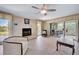 Inviting living room features a fireplace, sliding glass doors, and wood flooring at 123 Tidy Island Blvd, Bradenton, FL 34210