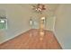 Bright bedroom with hardwood floors and ceiling fan at 4264 Central Sarasota Pkwy # 116, Sarasota, FL 34238