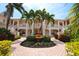 Two-story building with lush landscaping and a central fountain at 4264 Central Sarasota Pkwy # 116, Sarasota, FL 34238