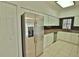 Kitchen with stainless steel refrigerator and pantry at 4264 Central Sarasota Pkwy # 116, Sarasota, FL 34238